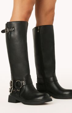 Take your style to new heights with this edgy take on a classic combat boot featuring statement buckle detailing. Tall Boots With Buckles, Bell Bottoms And Sweater, Moto Boots Outfit, Fall And Winter Boots, Biker Boots Outfit, Groomsmen Accessories, Winter Boots Outfits, Black Moto Boots, Maternity Bridesmaid Dresses