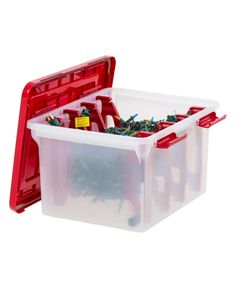 two plastic storage containers filled with assorted screws and wires, one is red