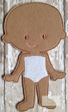 a brown teddy bear with a white diaper on it's chest and eyes