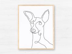 a line drawing of a dog's face in black and white on a wooden frame