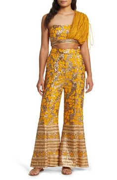 This sequined and beaded set features a cropped top with a single adjustable shoulder and palazzo pants with a high waist and side pockets. 15" top length; 30" inseam, 38" leg opening; 15" front rise; 18" back rise (size Medium) Top has drawstring-adjustable one-shoulder neck Pants have side-seam pockets Lined 100% viscose Spot clean Made in India Asian Owned/Founded Co Ords Outfits, Black Palazzo Pants, Coverall Jumpsuit, Printed Palazzo Pants, Designer Clothes For Men, Modern Outfits, Palazzo Pants, Women's Summer Fashion, Cropped Top