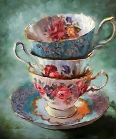 three tea cups and saucers are stacked on top of each other with flowers painted on them