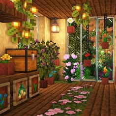 a room filled with lots of plants next to a window covered in flowers and greenery