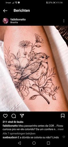 a bird sitting on top of a flower covered arm