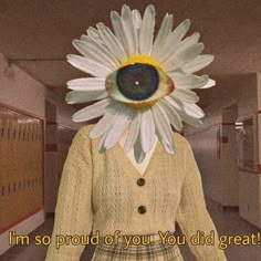 a woman with a large flower on her head in an office hallway that says, i'm so proud of you you did great