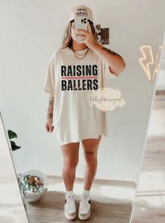 Raising ballers Shirt, Comfort Colors® Retro Baseball, Mother's Day Gift, Motherhood Shirt, Mom Life Tee, Softball Mom, Baseball Mama 📋 HOW TO ORDER: 1. Select the size ( Comfort Colors® Fit is true to size - please size up 2 sizes for oversized look) 2. Select the color  3. Select the quantity  4. Add personalization if required 5.Add to Cart ("buy now" will take you directly to checkout and "add to cart" will allow you to continue shopping with us) 6. Submit order (Shipping will automatically Mom Baseball Game Outfit, Baseball Mom Gear, Relaxed Fit Tops For Football Season, Relaxed Fit Tops With Team Name For Football Season, Sports Fan Relaxed Fit Top With Team Name, White Slogan Top For Sports Events, Relaxed Fit Tops With Text Print For Sports Events, White Relaxed Fit Shirt For Game Day, Baseball Mom Aesthetic