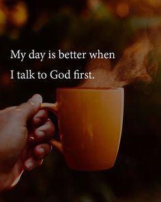 someone holding a coffee cup with the words, my day is better when i talk to god first