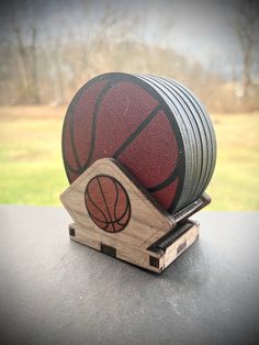 a basketball on top of a wooden stand