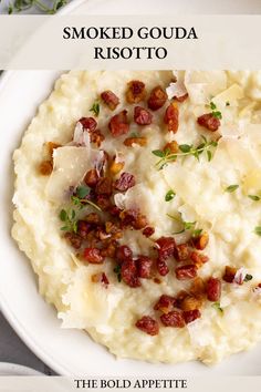 a white plate topped with mashed potatoes and bacon