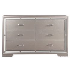 a silver dresser with six drawers and two doors on the bottom drawer, in front of a white background