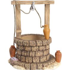 a water fountain made out of wood and stone