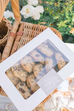 a basket full of cookies sitting on top of a table