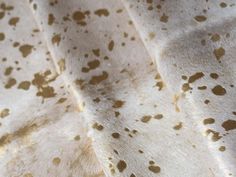 brown spots are on the white fabric