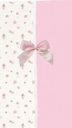 a pink and white wallpaper with a bow on the top left corner, and flowers on the right side