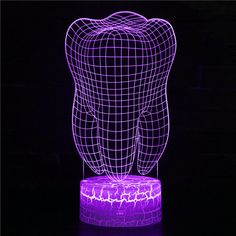 a purple light that is shaped like a tooth