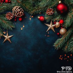 christmas decorations and pine cones on a dark blue background with space for text or image