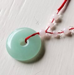 Ice jade pale green donut disc red silk cord necklace Beautiful, untreated, undyed, natural jade stone 1 inch disc Adjustable silk cord to 30 inches Adjustable Round Jade Necklaces, Green Donut, Silk Cord Necklace, Pottery Patterns, Ice Star, Kids Projects, Silk Cord, Tiny Hand, Natural Jade