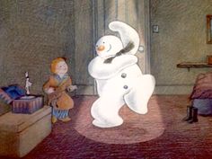 there is a snowman standing in the living room next to a man with a teddy bear