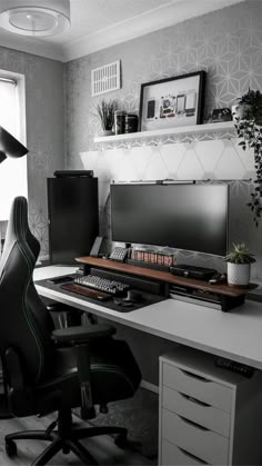 a black and white photo of a home office