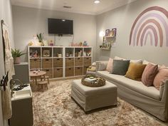 a living room filled with furniture and lots of storage