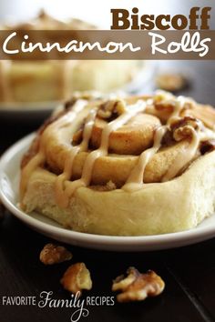 a close up of a waffle on a plate with walnuts around it and the words biscoff cinnamon rolls