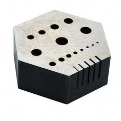 a black and white object with holes in it