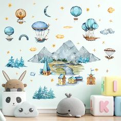 a wall with many balloons flying over it and some animals on the floor next to it