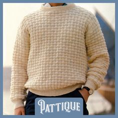 a man wearing a white sweater and black pants with the words patique on it