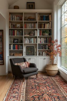 a living room filled with lots of furniture and bookshelves next to a window