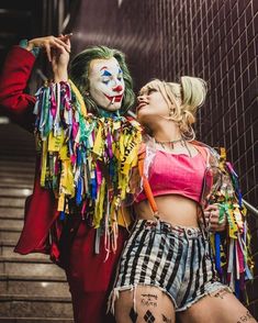 two women dressed up as clowns posing for the camera with their faces close together