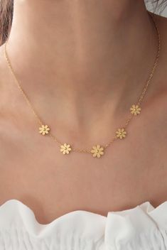 "High-quality gold plated stainless steel flower necklace for women, flower jewelry, dainty necklace, delicate jewelry, girlfriend necklace ✨ Stop worrying about your jewelry being tarnished, discolored, rusted, or scratched with 316L stainless steel.  ✨ The necklace is entirely made of 316L high-quality stainless steel, which makes it more durable in harsh conditions (swimming, showering, and chemical contact). ✨ 316L steel is naturally anti-allergenic, so it won't cause any allergy. ✨ The stainless steel mark is sealed as s-steel on the necklace. ✨ 316L is better than silver and feels like gold; therefore will make a perfect gift for you and your loved ones. ✨ 100% satisfaction guarantee; Return it within 14 days if you feel unsatisfied. ✨ Please don't hesitate to get in touch with me wi Cheap Gold Flower Necklace For Party, Cheap Dainty Flower Necklace For Gift, Cheap Dainty Gold Flower Necklace, Dainty Rose Gold Flower Necklace With Clavicle Chain, Dainty Rose Gold Flower Necklace, Minimalist Flower-shaped Necklace With Delicate Chain, Dainty Flower Jewelry Tarnish Resistant, Dainty Flower-shaped Tarnish-resistant Jewelry, Feminine Flower Pendant Necklace With Delicate Chain