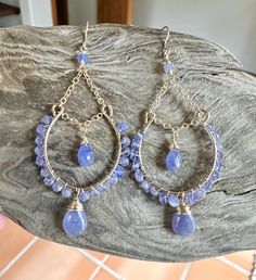 Gold filled chandelier earrings with tanzanite gemstones Gold Chain Earrings Designs, Hoop Earring Ideas, Sapphire Dangle Jewelry, Fine Jewelry Gemstone Chandelier Dangle Earrings, Wire Wrapped Metal Chandelier Earrings For Gift, Diy Dangle Earrings Ideas, Handmade Elegant Tanzanite Jewelry, Wire Wrapped Chandelier Earrings For Festivals, Elegant Handmade Tanzanite Jewelry