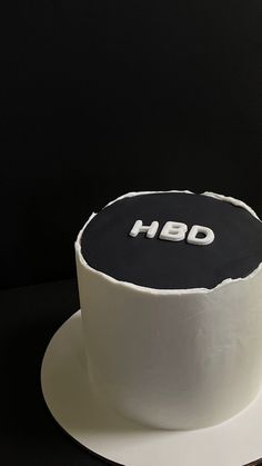 a black and white cake sitting on top of a table