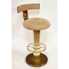 a gold colored bar stool with an adjustable foot rest