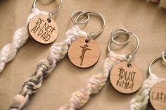 several different types of key chains with words on them