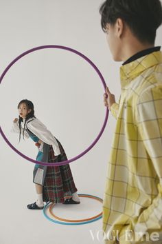 a woman standing in front of a hoop