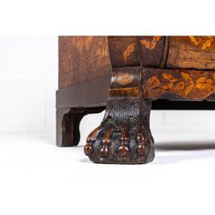 an ornately carved wooden bench on white background