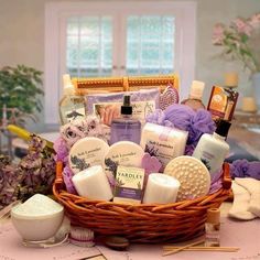 a basket filled with lots of different types of soaps and lotions on top of a table