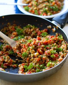 two pans filled with food on top of a table