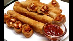 a white plate topped with fried food and dipping sauce