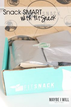 an open box with some snacks in it and the words snack smart with fitsack