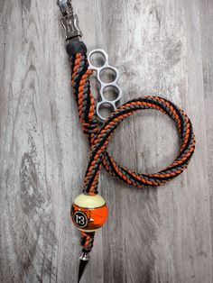 an orange and black leash with two pairs of scissors