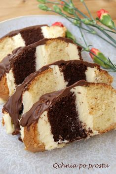 three pieces of cake with chocolate frosting on a plate