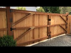 a wooden fence with two gates on each side