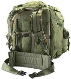 an army green backpack with straps on it