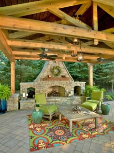 an outdoor living room with fireplace and patio furniture