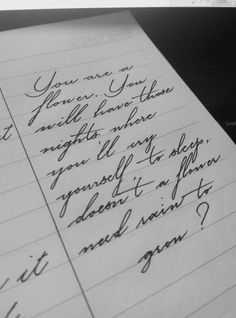 a handwritten note on lined paper with cursive writing in black and white