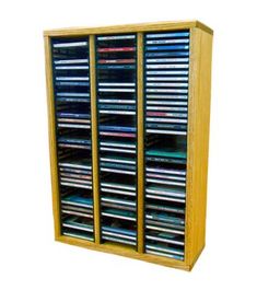 a wooden cabinet with many different types of dvd's