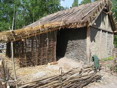 a small hut made out of sticks and straw