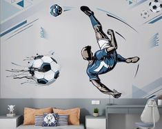 a bedroom with a soccer mural on the wall